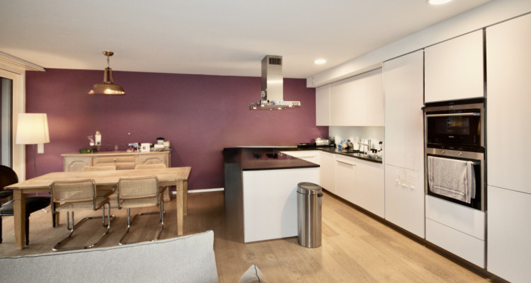 5.5-room THPE apartment with balcony, indoor parking and wellness access image 1