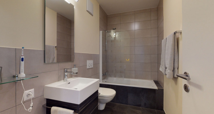 Moderne neuwertige Wohnung mit Privatgarten im Dorenbach Quartier image 11